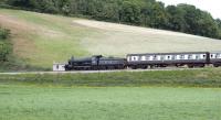 Scene on the West Somerset Railway on 30 May 2010 showing ex-GWR 9351 approaching Williton with a westbound train for Minehead.<br><br>[Peter Todd 30/05/2010]