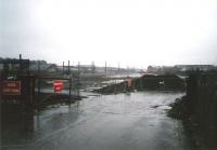 A rail-served coal yard once occupied the site between Haymarket <br>
station and the rail depot.The tracks had gone by the time I knew it, but at least one merchant, Bruce Lindsay Waldie, survived into the nineties.By the time of this photograph in January 1998 the site had been cleared and was looking as bleak as the weather. The site is now occupied by office buildings accessed by a road opened in 1999 called 'Haymarket Yards'. <br>
<br><br>[David Panton  /01/1998]