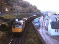 Not a typical locomotive at Clachnaharry in 1977. A Class 27 (rather than the usual Class 24 or 26) slows an Inverness-bound freight towards the Caledonian Canal swing bridge.<br><br>[Frank Spaven Collection (Courtesy David Spaven) //1977]