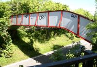 The recently repainted footbridge linking Edinburgh's Dundee Terrace and Dundee Street over the trackbed of the former Caledonian main line a mile out of Princes Street station. View is north east from the Dundee Terrace side back towards the site of Dalry Junction. Photographed on 3 June 2010 [see image 29220].  <br>
<br><br>[John Furnevel 03/06/2010]