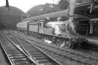 Last of the D20s. Nearing the end of its life, Worsdell D20 4-4-0 (ex-NER 'R' class) locomotive no 62395, at Newcastle Central on 24 August 1957. All 60 of the class were built at the NER's Gateshead Works and this example (built in 1907) was withdrawn from 52D Tweedmouth shed 3 months later and cut up at Darlington Works in February 1958.   <br>
<br><br>[Robin Barbour Collection (Courtesy Bruce McCartney) 24/08/1957]