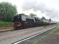 6233 <I>Duchess of Sutherland</I>, in gleaming LMS black livery, heads for Blackpool North with an excursion from Derby and Crewe. The loco is seen here accelerating its twelve coaches along the avoiding lines at Kirkham as seen from the station's island platform.<br><br>[Mark Bartlett 05/06/2010]