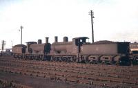 A pair of neglected looking Caley Jumbos, nos 57418 and 57369, standing in Polmadie shed yard in September 1959. <br><br>[A Snapper (Courtesy Bruce McCartney) 26/09/1959]