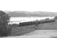 BR Standard class 5 4-6-0 no 73072 with a Glasgow Central - Wemyss Bay train alongside the south bank of Clyde near West Ferry in September 1966. The train has just cleared Bishopton Tunnel and is making for Langbank.<br><br>[Colin Miller /09/1966]