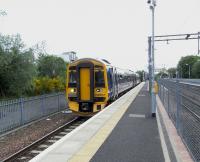 158 707 <I>Far North Line</I> prepares to leave platform 3 at Anniesland with the next service to Glasgow Queen Street on 3 June 2010.� It would be nice to think that, with glorious synchronicity, there's a set called <I>Maryhill Line</I> about to leave Thurso... but no. <br>
<br><br>[David Panton 03/06/2010]