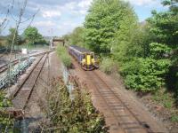 An early evening service from Mallaig runs in to Fort William passing the fuel terminal sidings. These were disused for some time but now see regular tank trains again. 156476 has just passed the bridge and embankment that used to carry the Lochaber Narrow Guage Railway and is nearing the station itself.  <br><br>[Mark Bartlett 18/05/2010]