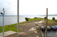 Standing on the station footbridge at Craigendoran in light rain on 8 June 2010. Photograph looking west over the site of the former pier platform and beyond across the Clyde towards Gourock. [See image 24286]<br>
<br><br>[John Furnevel 08/06/2010]