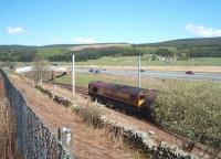 DBS 66106 gets the Dalston - Grangemouth tanks underway from Beattock Summit loops on 18 May and begins the long descent through the Clyde Valley.<br><br>[Mark Bartlett 18/05/2010]