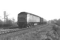 Class 47 no 1606 westbound on the 'Sub' between Niddrie West and Duddingston Junctions with an unidentified train of oil tanks on 4 February 1970.<br>
<br><br>[Bill Jamieson 04/02/1970]