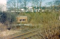 Remains of the water tower base and tuntable pit at Largs in 1982. The siding leading to them ran behind the SB, the edge of which is just visible on the extreme right. <br><br>[Colin Miller //1982]