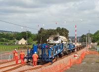 The first train between Bathgate and Armadale for 28 years heads west at walking pace near Boghead Junction on 9 June 2010 as sleepers are attached to the CWR.<br><br>[James Young 09/06/2010]