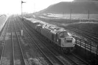 EE Type 4 no 266 approaches Niddrie West Junction with an unidentified fitted freight from Millerhill Yard in February 1970. The direct route to Monktonhall Junction and the ECML via Wanton Walls Jct is on the left and Newcraighall (Klondyke) Colliery stands in the background. <br><br>[Bill Jamieson 04/02/1970]