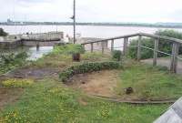 The remains of a wagon turntable on an old railway embankment overlooking Lydney Harbour with the lock gates and River Severn behind. A display board nearby showed pictures of coal, that had been brought down the Dean Forest Railway, being tipped into Severn barges from here and stated it was last used on 31st October 1960.<br><br>[Mark Bartlett 12/06/2010]