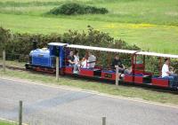 The Wells Harbour Railway in Norfolk is a ten and a quarter inch gauge railway, operated by both steam and diesel locomotives, running approximately a mile from the town and harbour, to a holiday park, adjacent to the beach. The railway was the first to gain a world record for the narrowest gauge on which a scheduled passenger service operated.<br>
<br><br>[Bruce McCartney 13/06/2010]