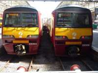 Basking in the sun at Helensburgh on 12 June 2010, units 320303 and 320319 at the buffer stops. <br><br>[John Steven 12/06/2010]