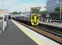 It's 17.07 on 4 June and the daily Carnoustie service pulls out in the care of a Class 158 (leading) and a 170. These mixed formations are not uncommon on east coast services. The train will split at Dundee and only the 158 will go forward to Carnoustie. This is not necessarily because the 170 is urgently needed in Dundee, but simply because 5 coaches is way too long for the platforms at Balmossie and Golf Street which can just squeeze in three. [See image 20229]<br>
<br><br>[David Panton 04/06/2010]