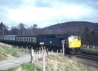 A brief respite for this Kyle train behind 5333 in the 1970s. The train is on the short stretch of 1 in 350 gradient through Achterneed, before resuming the battle up the otherwise continuous 1 in 50 from Fodderty Junction to the 458' Ravens Rock summit. A classic climb for 'head-out-of-the-window / right-behind-the-loco' viewing, before sprinterisation took the fun away!<br><br>[Frank Spaven Collection (Courtesy David Spaven) //]