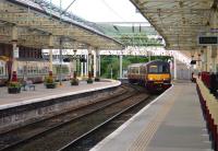 An Airdrie - Helensburgh service, formed by 320319, approaching its destination on 12 June 2010.<br><br>[John Steven 12/06/2010]