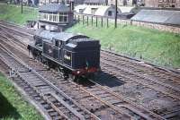 Gresley V3 2-6-2T no 67669 drifts tender first towards Craigentinny sidings in May 1958 on its way to pick up a train of empty stock. Craigentinny signal box stands in the background. <br><br>[A Snapper (Courtesy Bruce McCartney) /05/1958]