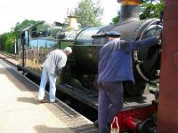 <I>So is this where the key goes?</I>  A wind-up at Holt station on the North Norfolk Railway on 15 June 2010. Locomotive ex-GWR 0-6-2T no 5619.<br><br>[Bruce McCartney 15/06/2010]