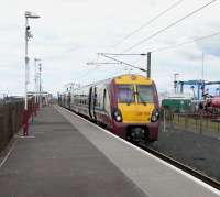 Ardrossan is easily the smallest settlement in Scotland (and possibly Britain) to have 3 network stations. The now hourly Harbour Branch trains visits all 3, which are less then a half-mile from each other.Even so, Ardossan South Beach is only just inside the boundary with Saltcoats and Ardrossan Harbour is, well, out on the Harbour. Ardrossan Town is half way between them. After picking up custom from the Arran Ferry on 14 June 334 039 prepares to leave Harbour station on its crawl over 2 level crossings to Town station and, ultimately, Glasgow Central. <br>
<br><br>[David Panton 14/06/2010]