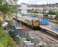 A mid-afternoon train for Helensburgh Central leaves Airdrie on 14 June 2010.<br><br>[John Furnevel 14/06/2010]