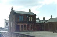 The main building at Ardrossan Town in 1985 with Princes Street level crossing on the left. Gates, canopies, footbridge etc had all gone by this time. [See image 4125]<br><br>[Colin Miller //1985]