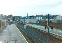 View over Largs station towards the buffer stops in late July 1995, shortly after the debris from the crash earlier in the month had been cleared away. Note the bright shiny new buffer stop replacing the one carried away by the emu that ran through the end of the platform and out of the station onto Main Street [see image 19774].<br><br>[Colin Miller /07/1995]