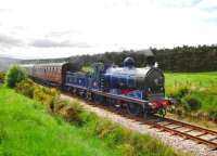 <I>I'm Back!</I> Immaculate Caledonian 0-6-0 no 828 looks in fine fettle following its 220,000 major overhaul as it heads the last train of the day mid-way between Boat of Garten and Broomhill on 17 June 2010. [See recent news item]<br><br>[John Gray 17/06/2010]