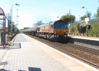 66 111 heads north through Greenfaulds station with an oil train on 17 June 2010.<br><br>[David Panton 17/06/2010]