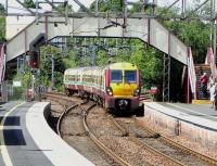 334 010 clatters over the junction pointwork at Dalreoch on 15 June  with a Helensburgh - Airdrie service (Drumgelloch temporarily closed due to A-B works).<br><br>[David Panton 15/06/2010]