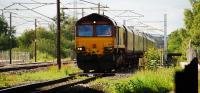 66121 southbound on the slow line at Mossband Junction. The buffer stop on the right is part of the Longtown complex of sidings.<br><br>[Ewan Crawford 14/06/2010]