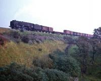 Britannia Pacific no 70054 <I>Dornoch Firth</I> climbs Shap with a down freight in the mid sixties. The location is thought to be just short of Trundle Beck, between Salterwath and Shap Wells.<br><br>[Robin Barbour Collection (Courtesy Bruce McCartney) //]