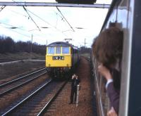 The first day of the 'Electric Scots' [see image 42691] seen from the Edinburgh portion of a southbound WCML train waiting in the loop north of Carstairs station on the morning of Monday 6th May 1974. The driver of the Glasgow portion queries when he'll get the road. <br><br>[David Spaven 06/05/1974]