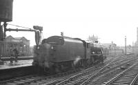 Stanier 8F 2-8-0 no 48033 stands at the west end of Manchester Exchange on 23 June 1968 biding its time before taking over the final leg of the LCGB (North West Branch) <I>Two Cities Limited</I> railtour from Manchester Victoria to Liverpool Lime Street.<br><br>[K A Gray 23/06/1968]