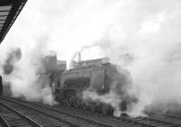 Stanier Coronation Pacific no 46247 <I>City of Liverpool</I> stands on the centre road at Carlisle, probably in the early 1960s. The locomotive was withdrawn from Kingmoor shed in May 1963 and scrapped at Crewe Works in July the same year.<br><br>[K A Gray //]