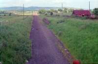 Armadale looking east away from the former station in 1988. Curiously the retaining wall was on the south side of the line whereas today it is on the north side. [See image 29572] for the same view in 2010.<br><br>[Ewan Crawford //1988]