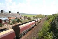 66140 takes a coal train south through Racks on 13 May 2010. Note the name of the station (closed in 1965) formed out of white bricks on the side of the cutting to the left of the first vehicle.<br><br>[John Furnevel 13/05/2010]