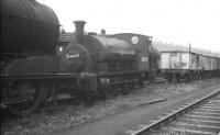 Ex-Caledonian <I>Pug</I> 0-4-0ST no 56029 stands in the sidings at Dawsholm on 23 May 1959. Not, as it might at first seem, part of a condemned line, since the locomotive was moved to Kipps shortly thereafter [see image 22947]. The 1895 veteran continued in service in the Coatbridge area for a further three and a half years, before being eventually withdrawn by BR at the end of 1962.  <br><br>[K A Gray 23/05/1959]