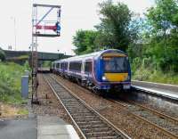 170 451 pulls into Dunblane with a Glasgow to Inverness service on 15 June 2010. Note the well-braced up starter signal DB14.<br><br>[David Panton 15/06/2010]