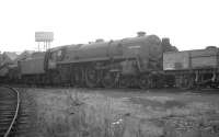 Withdrawn from Polmadie shed on the last day of 1962, BR Standard Pacific no 72002 <I>Clan Campbell</I> stands in the works reception sidings at Darlington MPD in October 1963.  The nameplates etc have been removed and the locomotive has been partially stripped down...  speaking of which... [Railscot note] the name applied in chalk to the space previously occupied by the official nameplate is <I>Mandy Rice-Davies</I>, who appeared in the headlines regularly that year, along with her flatmate Christine, a government minister named Profumo and a Russian spy named Ivanov. The Pacific is recorded as being cut up at Darlington in September 1963. As of 2010 Mandy is reportedly a 65 year old living quietly in Surrey with her third husband, having undergone (in her own words) 'the slow descent into respectability'.<br>
<br><br>[K A Gray 26/10/1963]