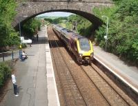 Cross Country Voyager 220025 calls at Liskeard on a service from Penzance. This view from the station footbridge looks west towards Moorswater viaduct and shows some of the lower quadrant semaphores that still control all movements in the station.<br><br>[Mark Bartlett 15/06/2010]