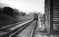 Last day of passenger services picture at the Holcombe Brook terminus, taken from the end of the platform just beyond the signal box. Two coach push pull set at the platform and enthusiasts milling around. By Cam's usual standards this picture is not of a high quality but it does provide a useful comparison with other recently submitted pictures that look towards the buffers at Holcombe Brook.<br><br>[W A Camwell Collection (Courtesy Mark Bartlett) 03/05/1952]