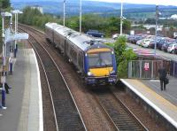 170 452 approaches the Edinburgh-bound platform at Falkirk High on 15 June. There's a new shelter on the other platform. It seems to have been designed by someone who thinks we need to challenge our assumptions about the appearance - and function - of a shelter. Clearly they are never going to have to use it.<br><br>[David Panton 15/06/2010]