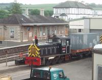 <I>Diesel preservation pioneer</I>. Class 03 DM 0-6-0 D2192 only lasted eight years in BR service and in 1969 was sold to the Dart Valley Railway. It has now spent forty one years serving the DVR and the Paignton and Dartmouth Steam Railway in a variety of liveries and currently sports a smart BR Black and the name <I>Titan</I> as seen here outside the engineering workshops at Churston, alongside the Brunel design station building. <br><br>[Mark Bartlett 14/06/2010]