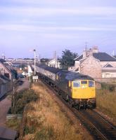 A northbound train powers away from Clachnaharry swing bridge shortly after leaving Inverness in the early 1970s.<br><br>[David Spaven //]