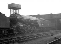 Gresley V2 2-6-2 no 60819, showing a 64A shedplate, stands in the yard at Darlington MPD on a grey and overcast day, possibly in connection with a visit to the nearby works. The locomotive spent its twilight years at St Margarets, from where it was withdrawn at the end of 1962. 60819 was eventually cut up at Inverurie works in October of 1963.  <br><br>[K A Gray //]