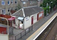 The 'homely' ticket issuing arrangements at Hillington East. View from the footbridge on 19 June 2010.<br><br>[David Panton 19/06/2010]