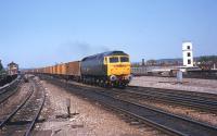 A Class 47 in Great Western Railway lined green livery about to run east through Reading station with empty <I>Binliner</I> refuse containers in May 1985.<br>
<br><br>[John McIntyre /05/1985]