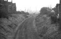A 1972 view along the Caledonian trackbed towards Slateford Yard from Shandon Place road bridge, just to the south west of Merchiston station. Shortly before reaching the yard the Caledonian line crossed the 'sub' on an overbridge, visible in the centre background [see image 11416].<br><br>[Bill Jamieson //1972]